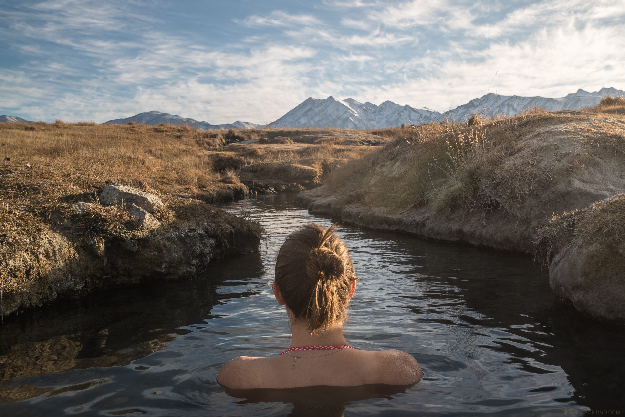 Back shot of woman in hot springs