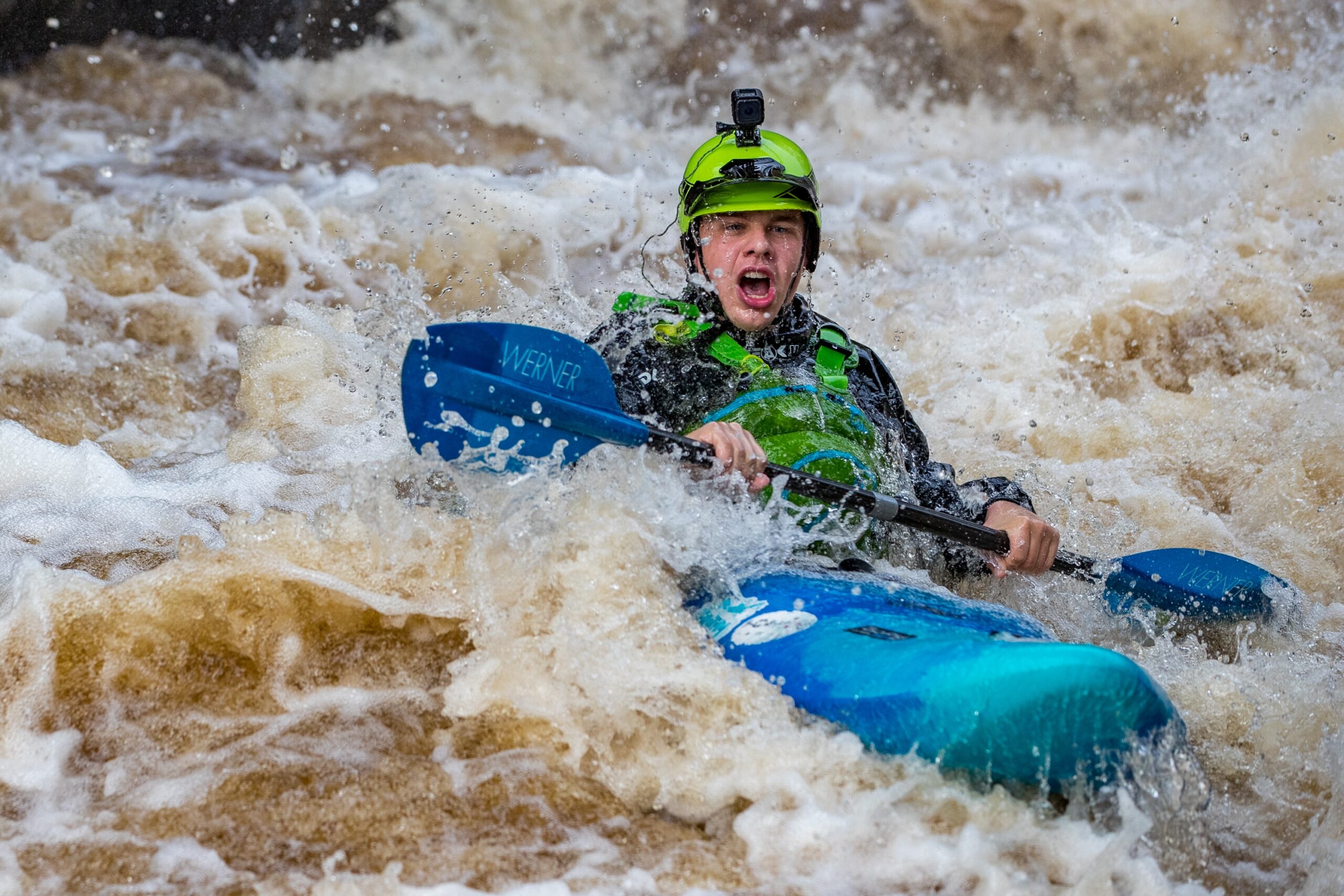 Man whitewater kayaking