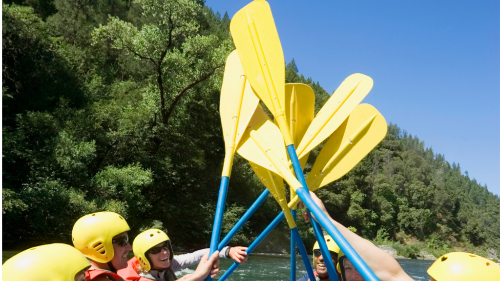 Rafters with oars up after Arkansas River rafting trip.