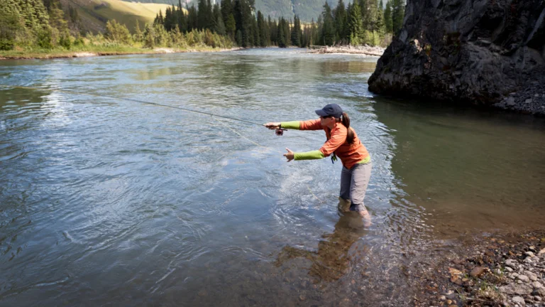 woman casting in Colorado stream