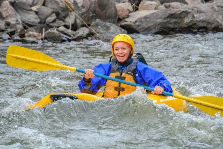 woman paddling inflatable kayak