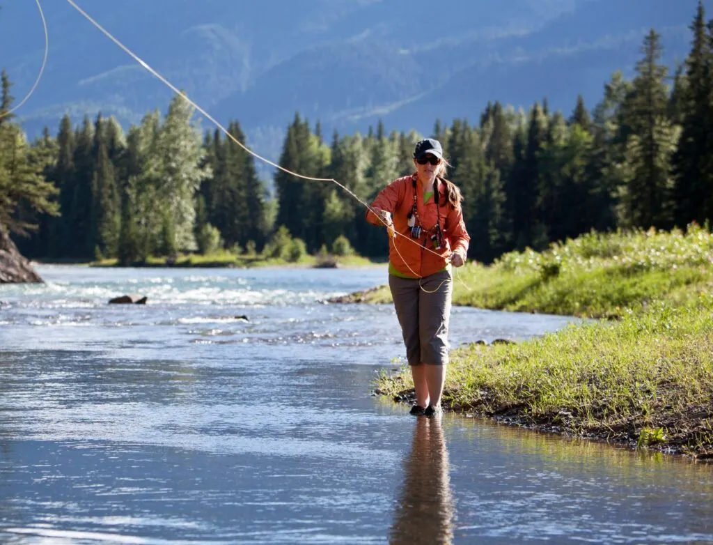 woman casting fishing line in Colorado river