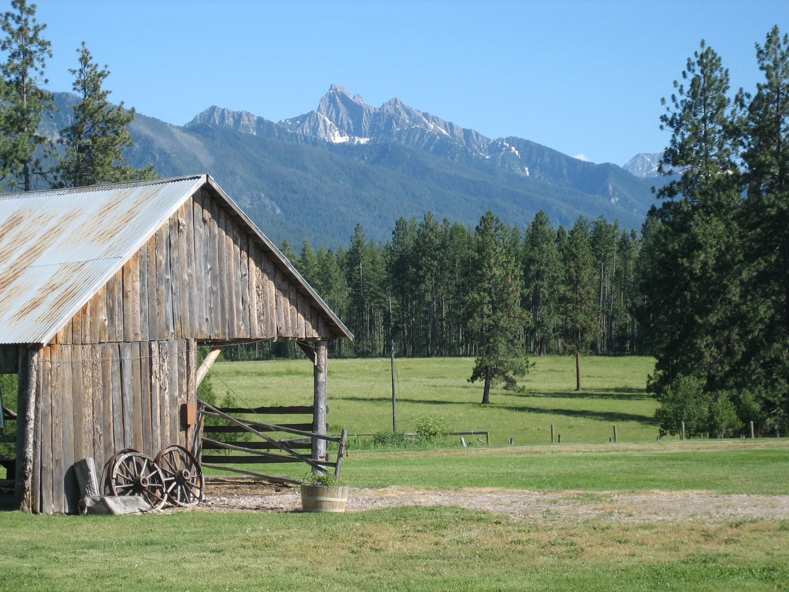 ranch amidst backdrop of mountains