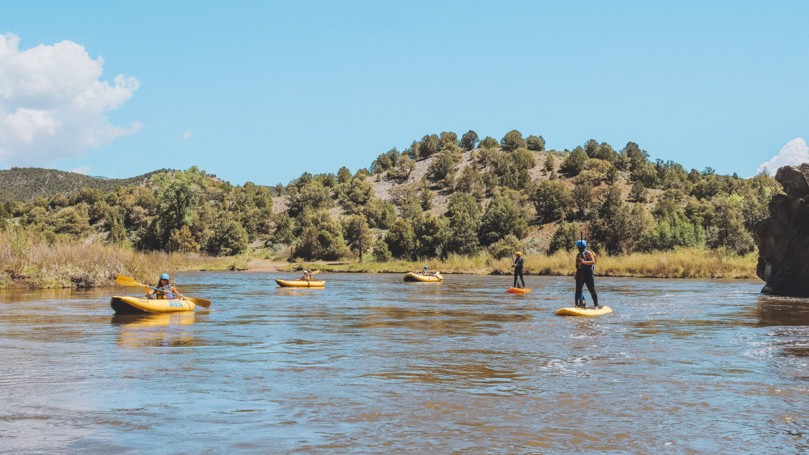 stand up paddleboards and inflatable kayaks on the Colorado River