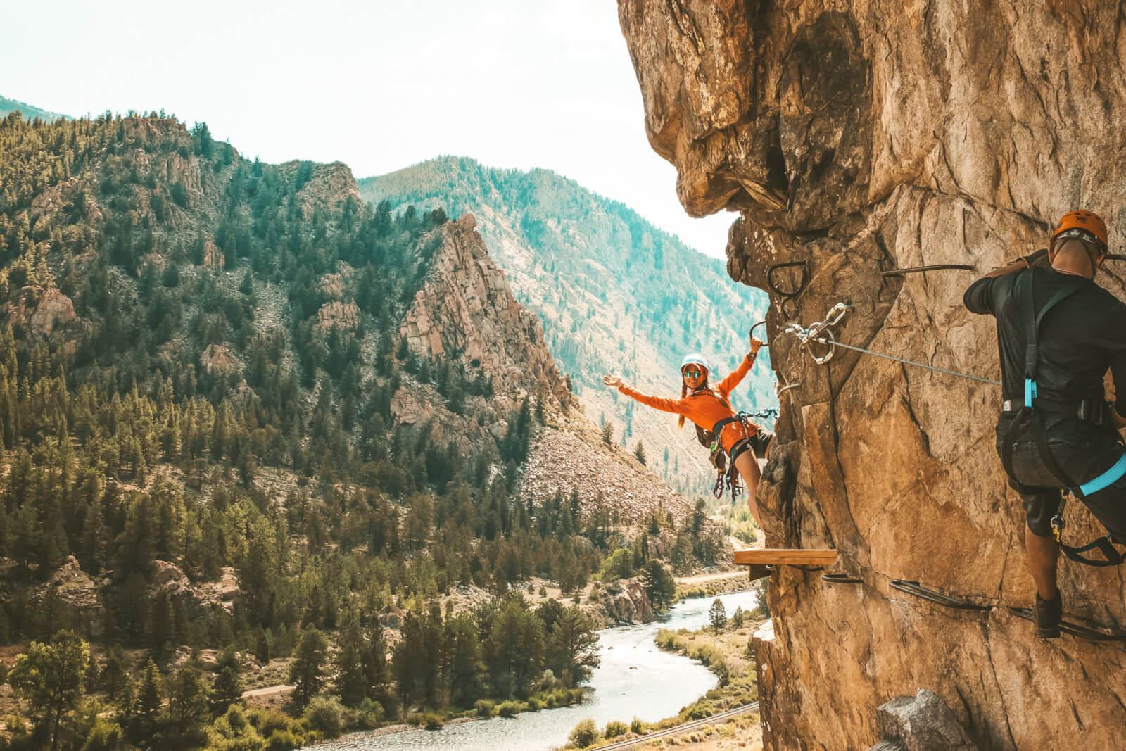 Woman showing off on the Granite Via Ferrata in the Summer