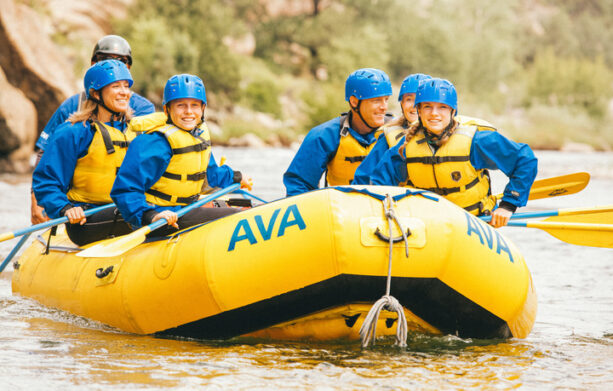 Group rafting smiling