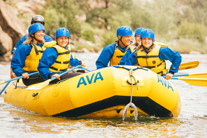 Group rafting smiling