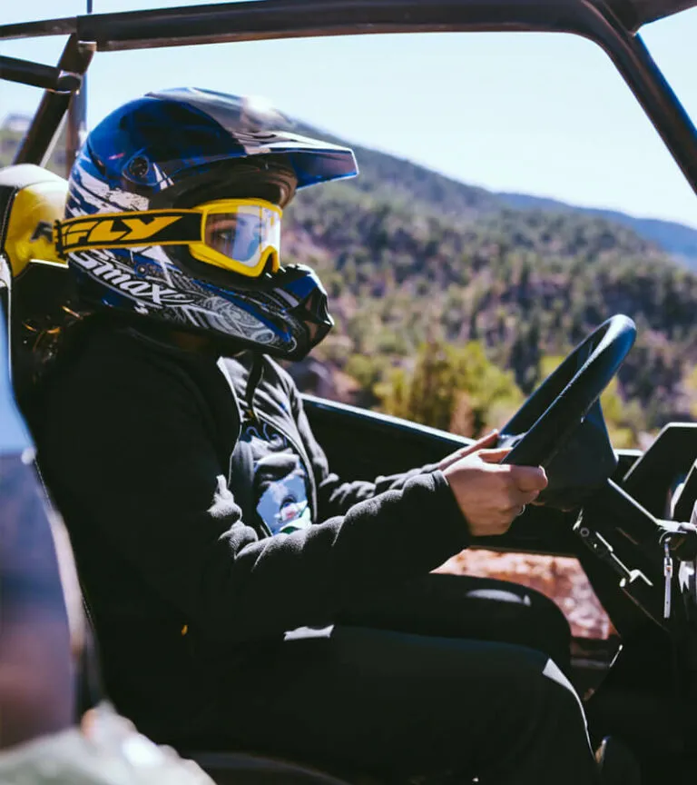 Woman driving a UTV rental