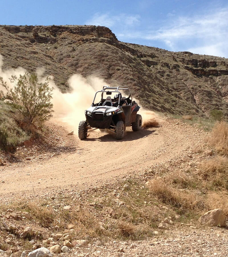 person driving a UTV through the dirt trails of Kremmling, Colorado