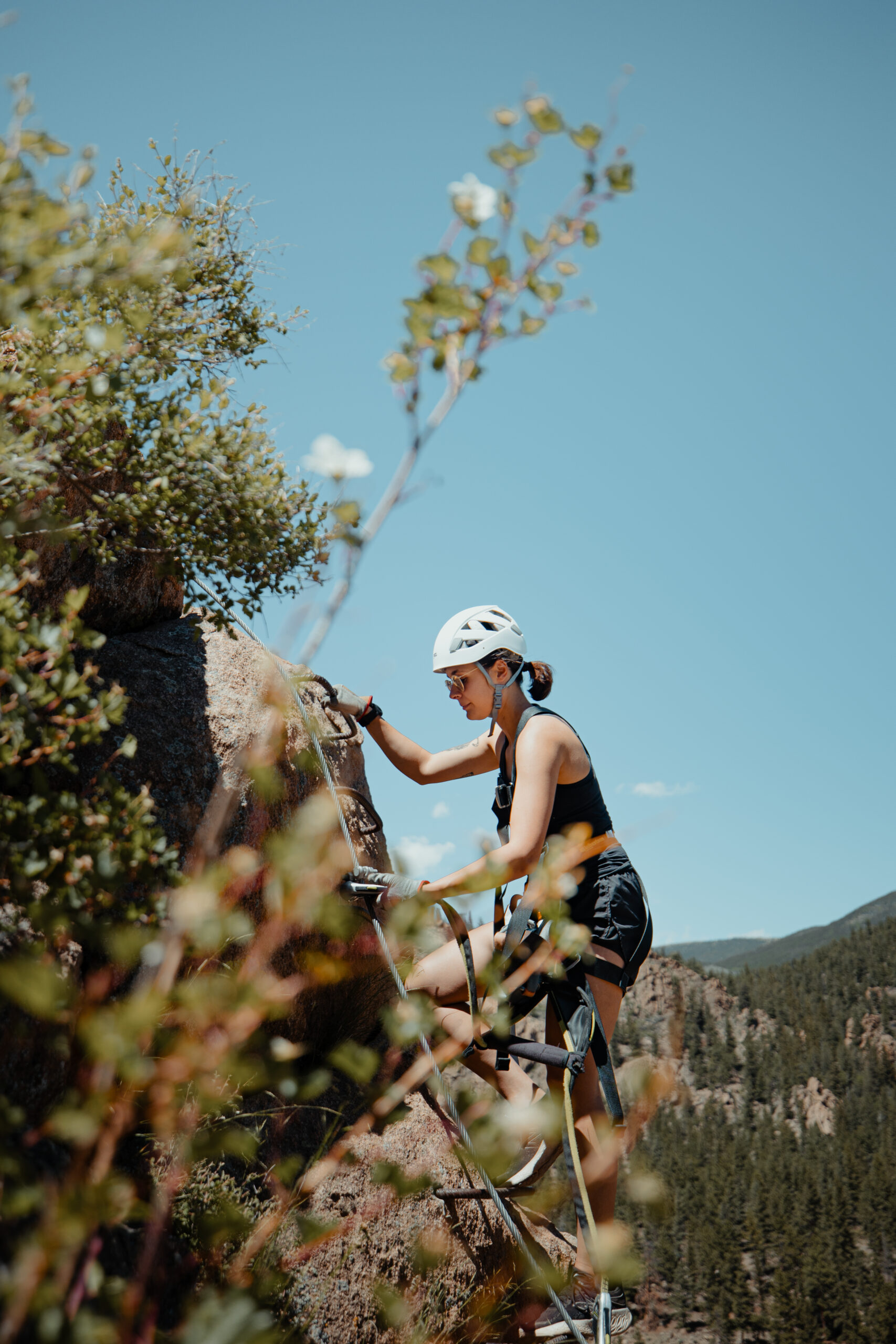 woman climbing via ferrata course
