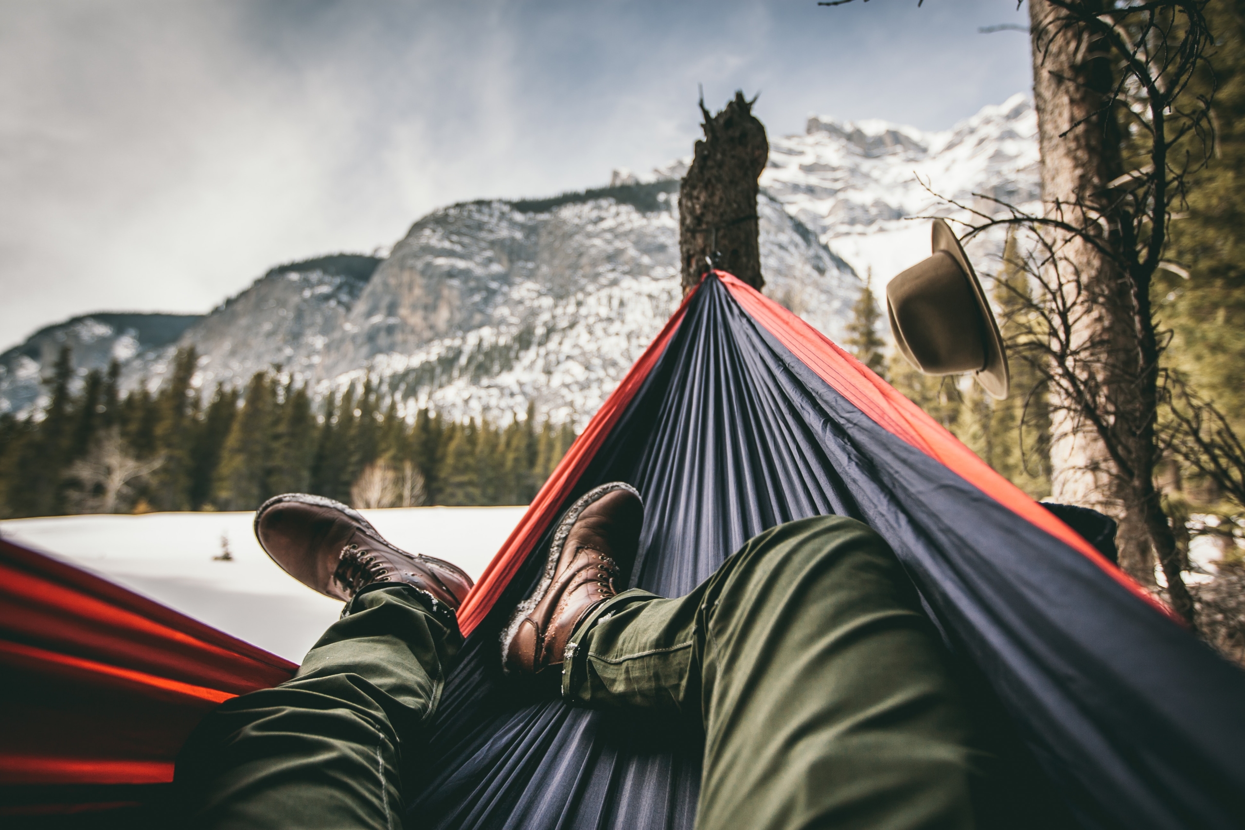 person relaxing in hammock