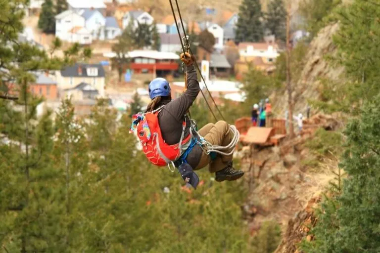 Denver Cliffside Zipline Colorado - Image of man ziplining in the mountains of Colorado.