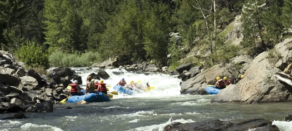 several groups paddling down the Clear Creek