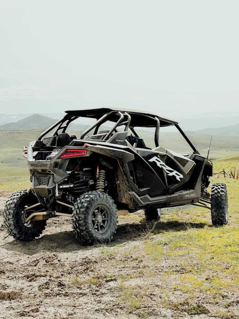 An off-road UTV parked in a Colorado mountain meadow.