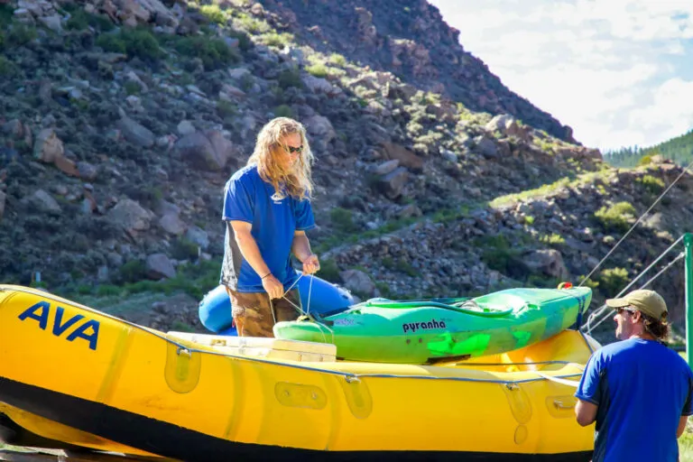 Guide securing kayaks and raft for transport