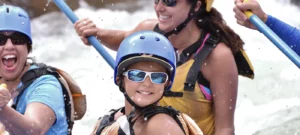Family enjoying a river rafting trip.