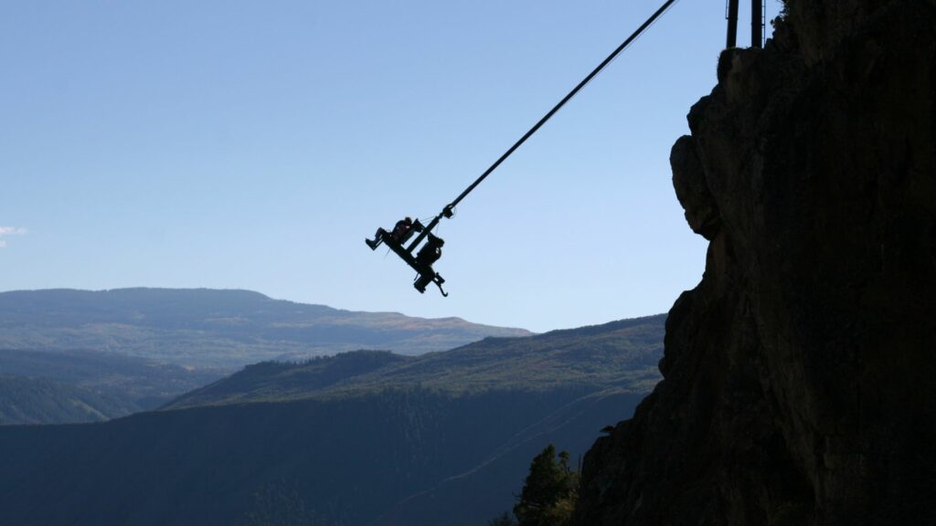 people riding aerial seat attraction