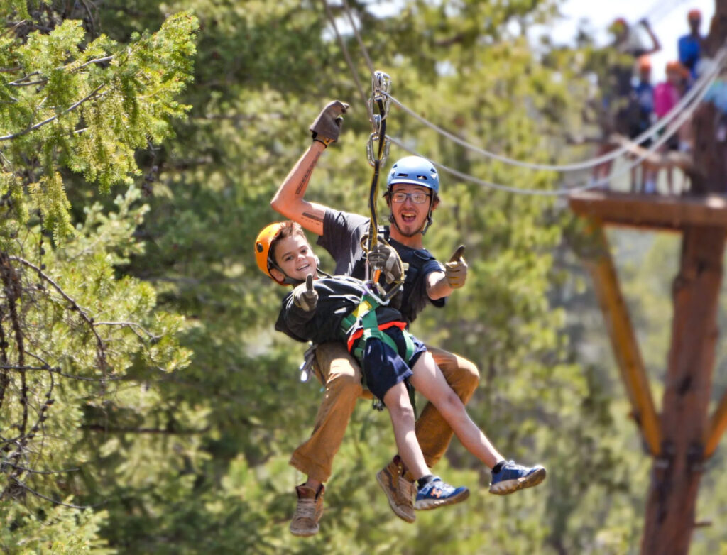 Father and child ziplining.