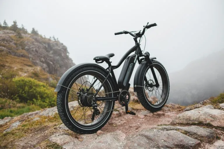 An e-bike bike parked on a mountaintop.