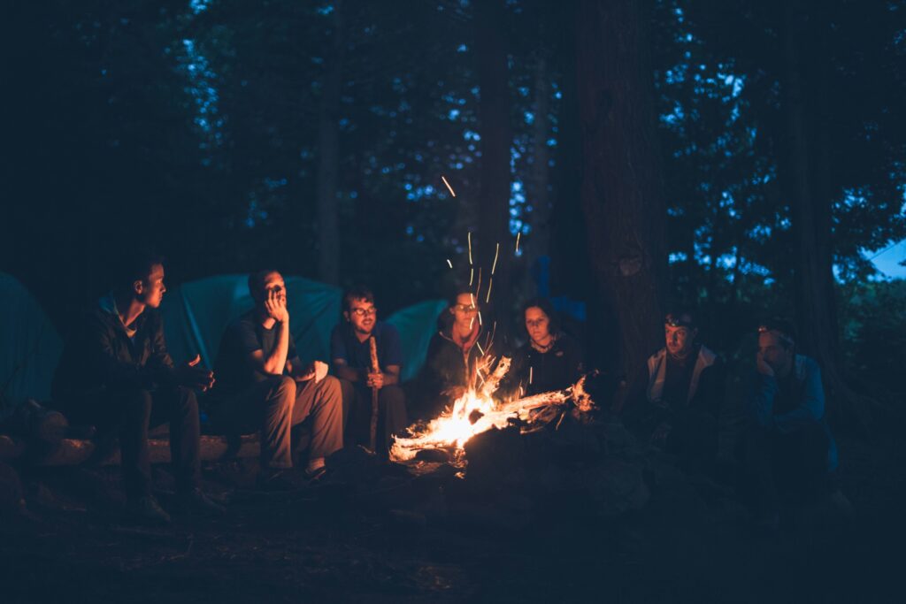 Group sitting around a campfire
