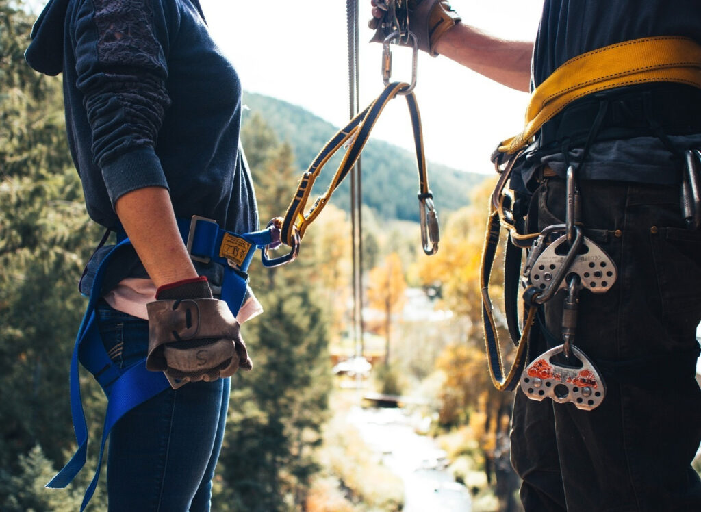 Man getting safety instructions before ziplining.