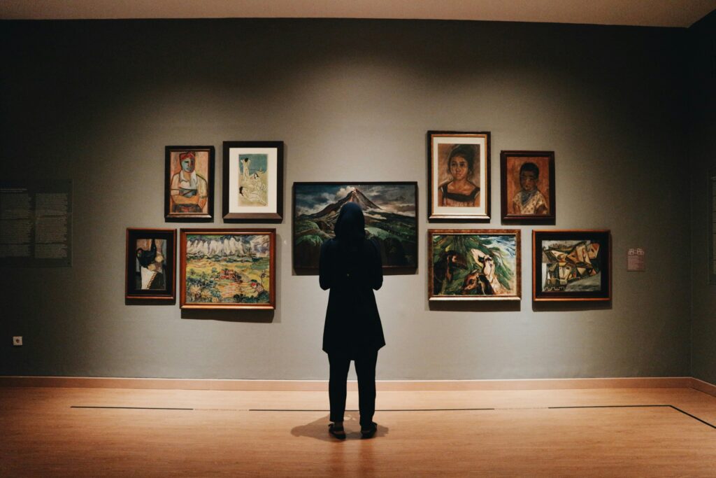 woman looking at art in museum