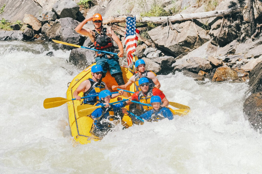 Fourth of July rafting trip with American Flag.