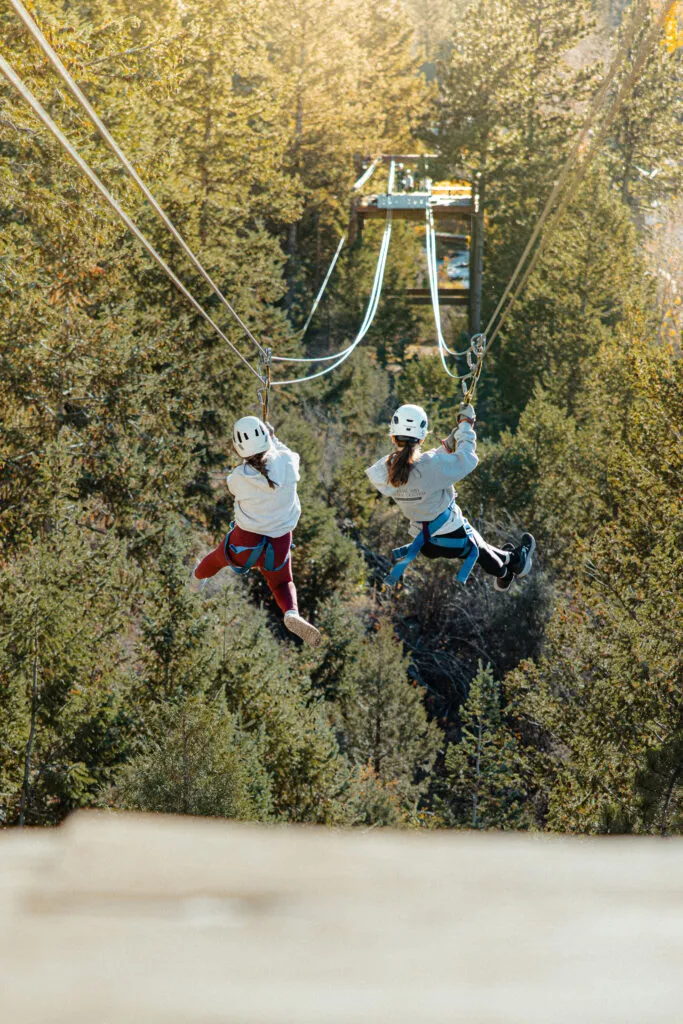 People ziplining in Colorado.