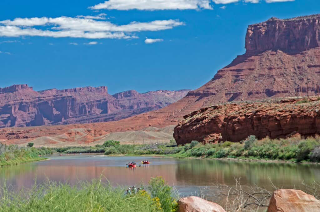 colorado river rafting and canoeing with scenic utah background