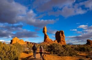 couple hiking in moab near arches national park