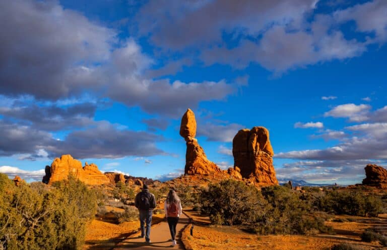 couple hiking in moab near arches national park